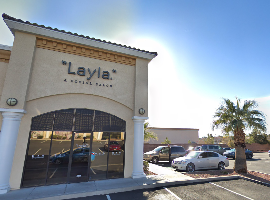 A building with a sign that says layla social on it
