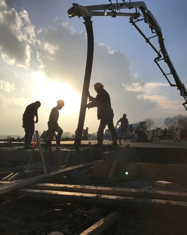 brothers sunrise work pouring concrete