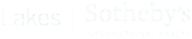 Faint white text on a very light background, barely visible.
