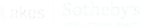 Faint white text on a very light background, barely visible.
