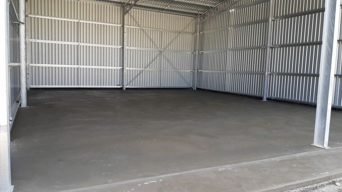 Parham Sheds - 32mpa/125mm/f92 concrete slab to 2 shed bays including concrete aprons for a machinery/hay shed