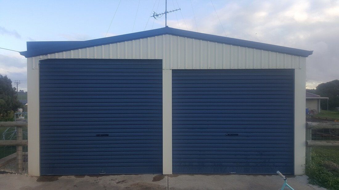 Shed Addition - Left hand side roller door raised by 220mm to allow caravan to be stored in shed