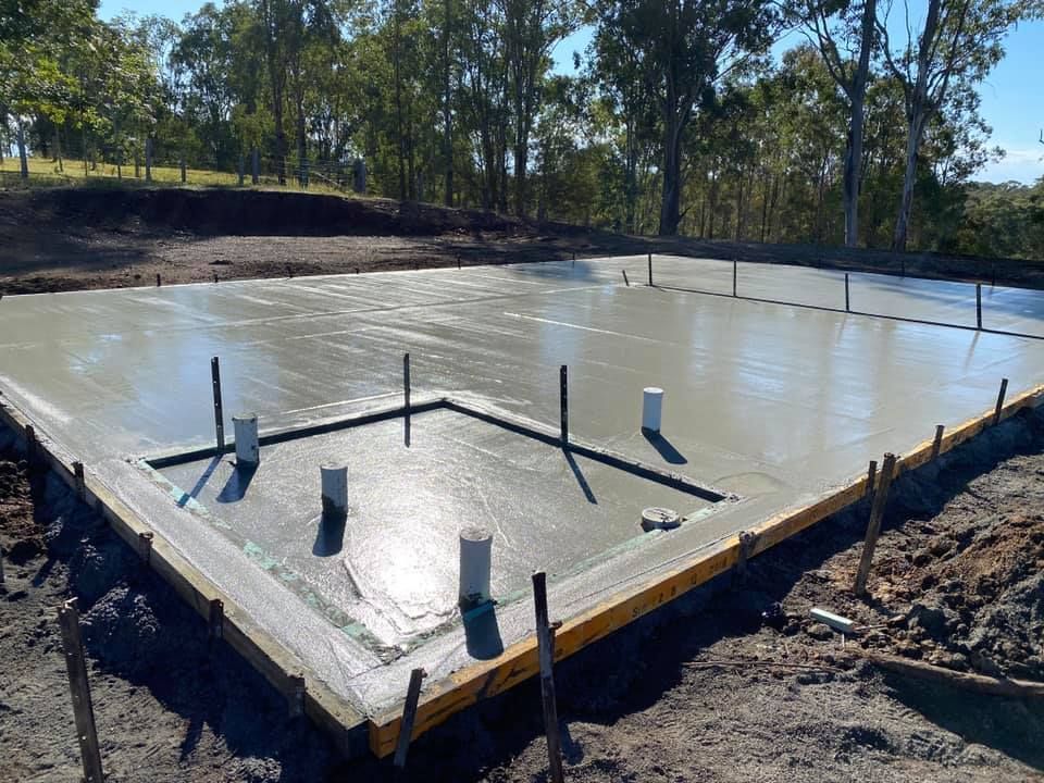 Concrete Foundation With Plumbing Pipes in a Rural Setting — Wal's Concreting Service Pty Ltd in North Casino, NSW