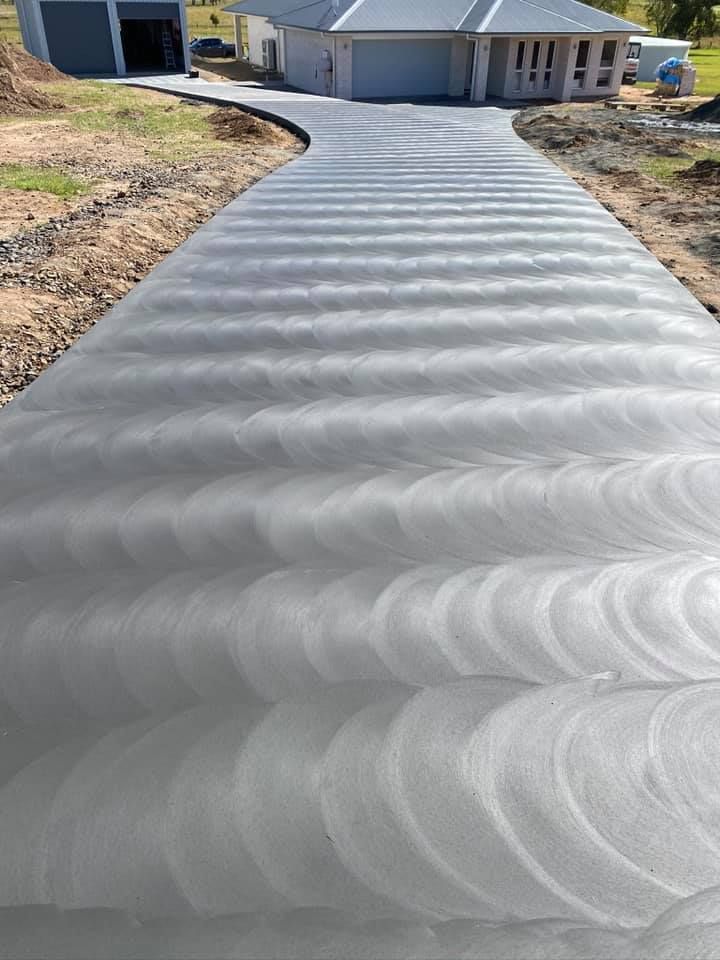 Newly Paved Driveway With Textured Circular Patterns — Wal's Concreting Service Pty Ltd in North Casino, NSW