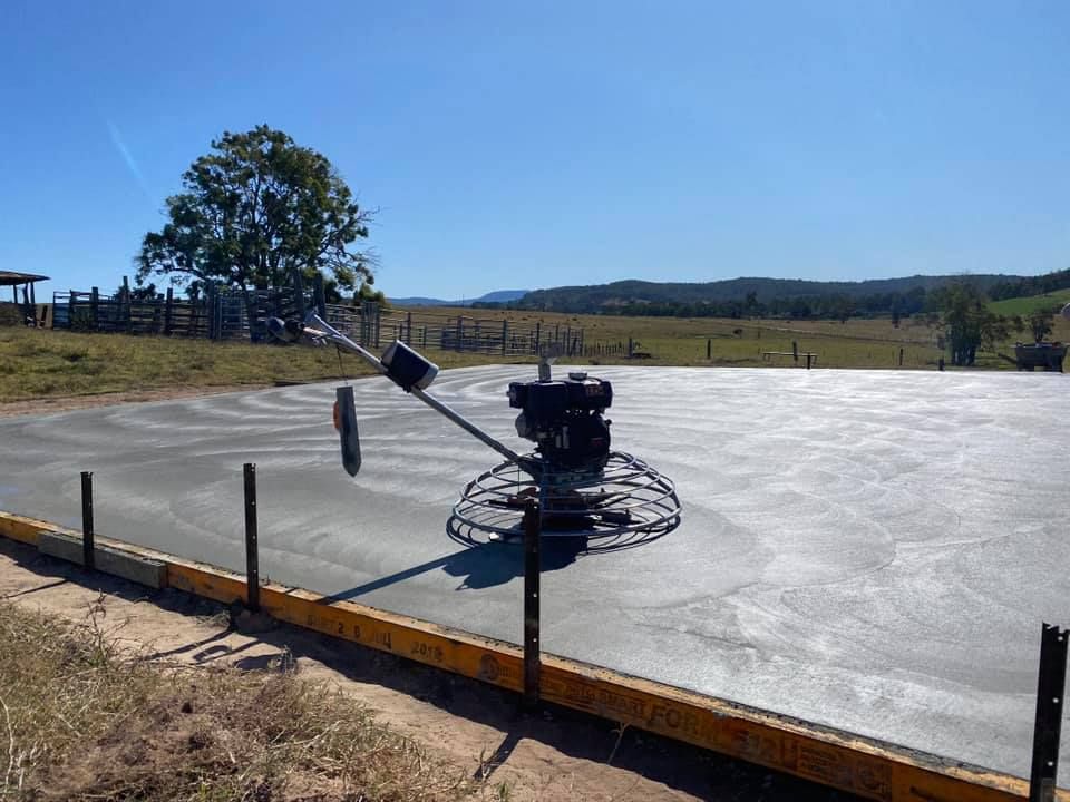 Power Trowel Smoothing a Large Concrete Slab on a Sunny Day — Wal's Concreting Service Pty Ltd in North Casino, NSW