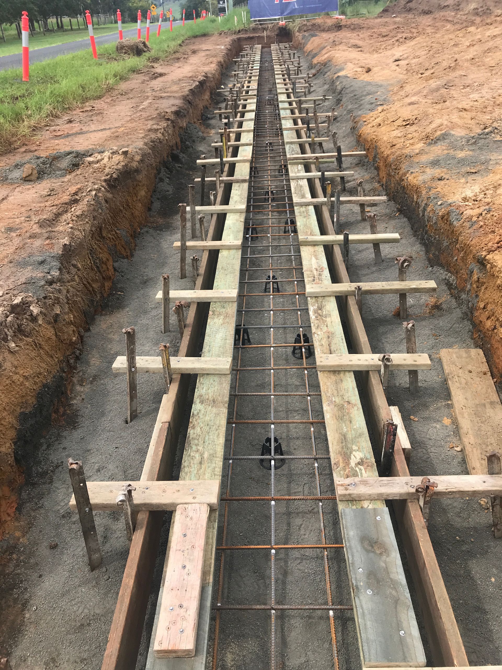A wooden frame pathway is preparing for concrete to be poured— Wal's Concreting Service Pty Ltd in Lismore, NSW