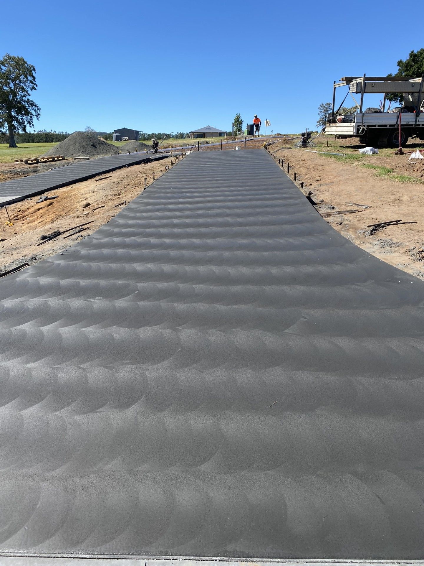 A large driveway is leading up a hill — Wal's Concreting Service Pty Ltd in Ballina, NSW