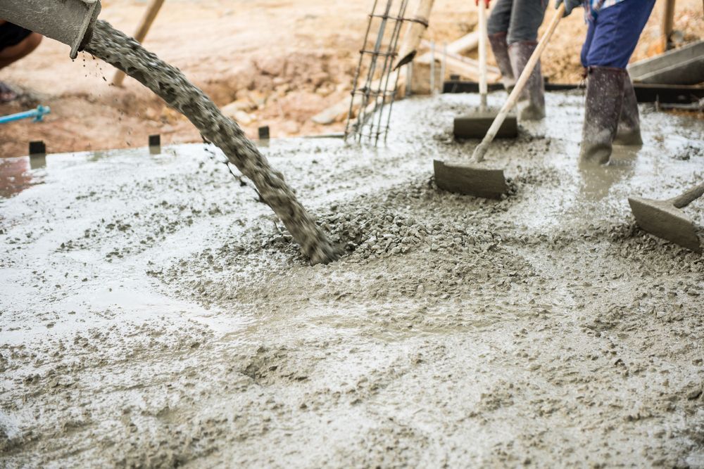 Concrete Being Poured From a Chute Onto a Foundation — Wal's Concreting Service Pty Ltd in North Casino, NSW