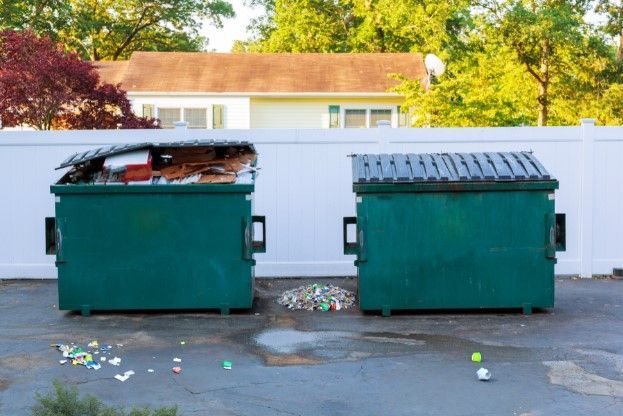 Two Green Dumpsters