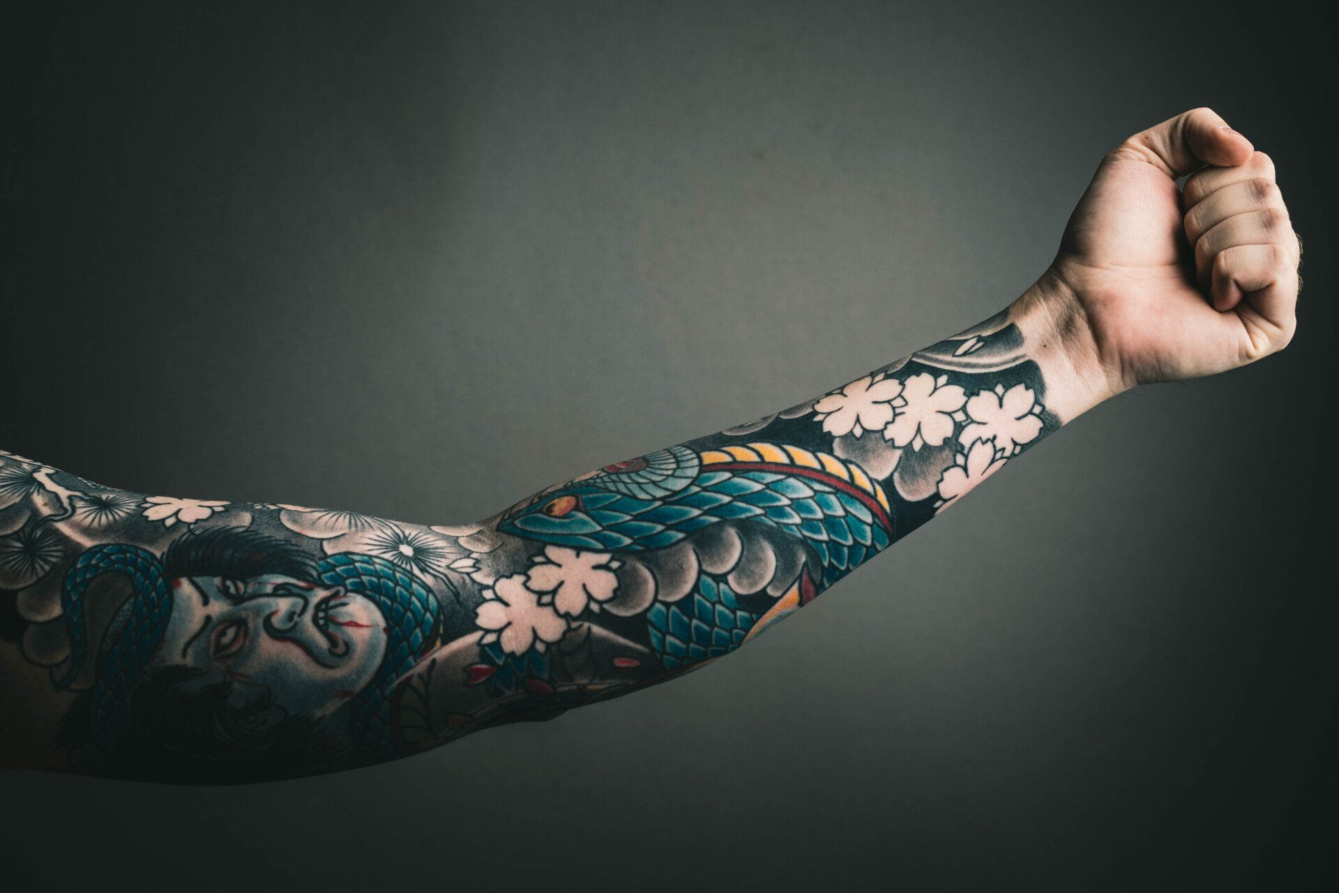 A close up of a person 's arm with a tattoo on it.