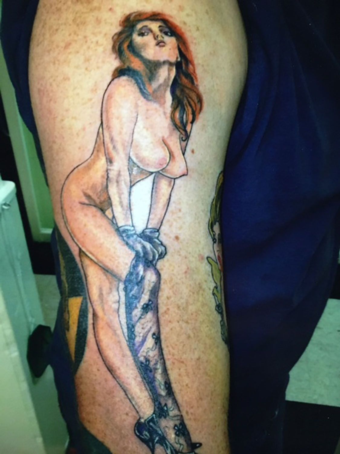 A woman putting on a pants