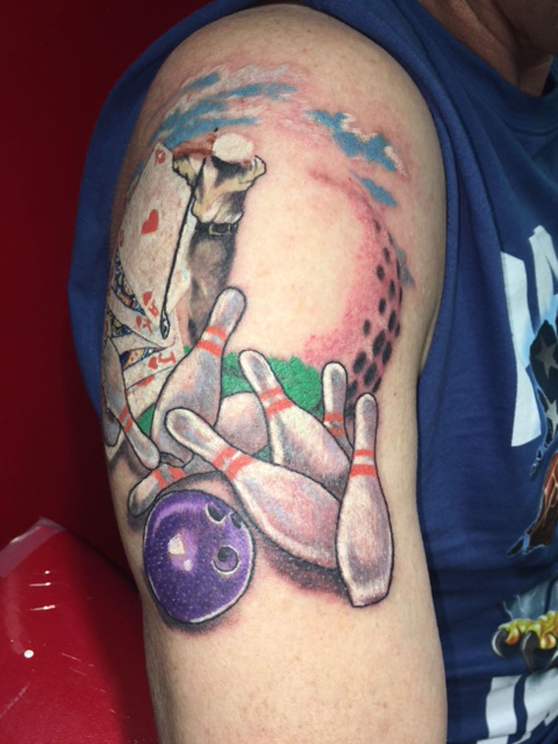 A man has a bowling tattoo on his arm