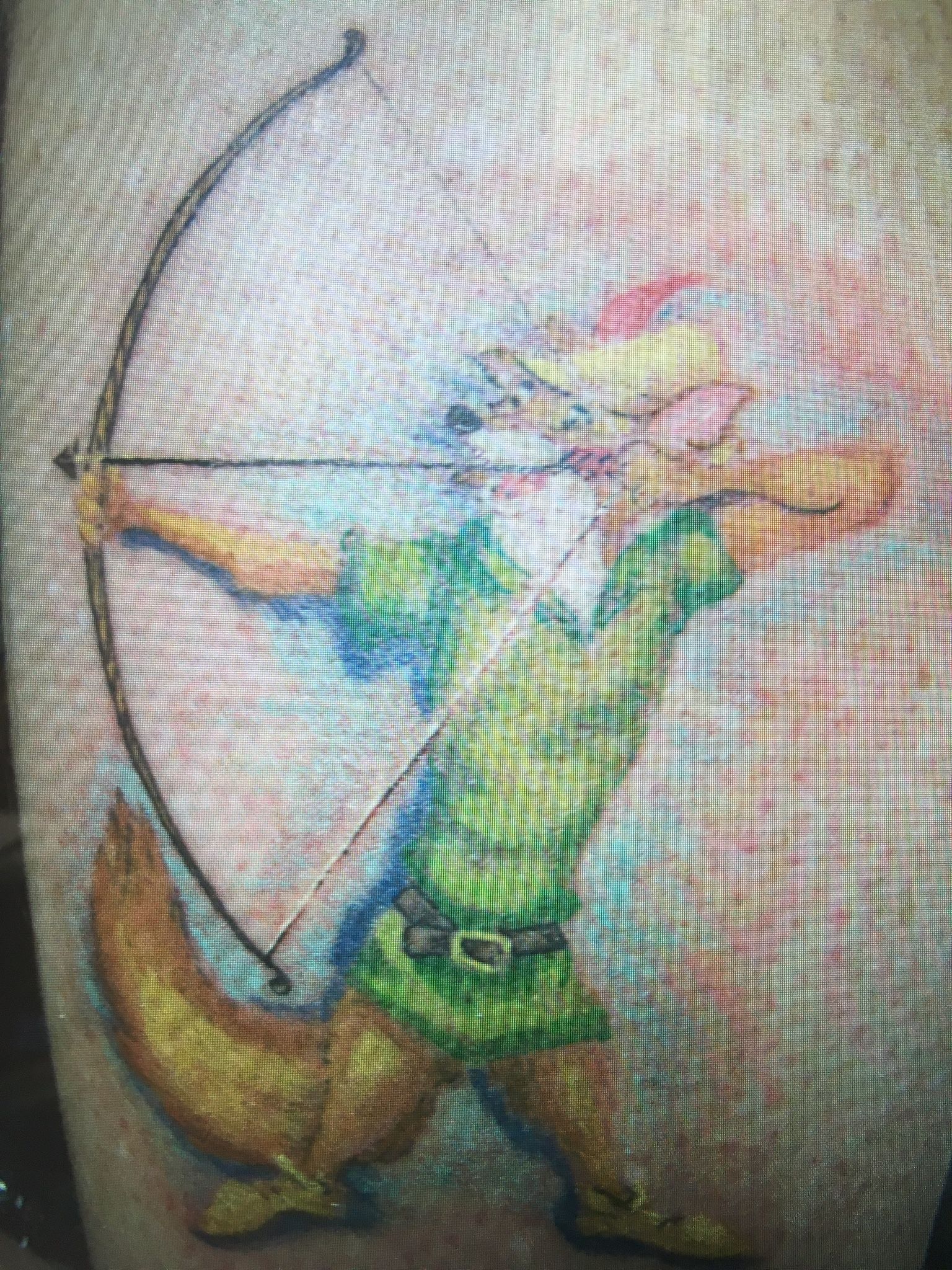 A cartoon fox with bow tattoo