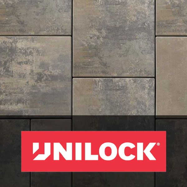 UNILOCK logo on a red banner over gray stone pavers