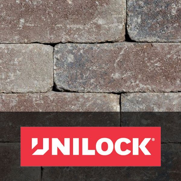 UNILOCK logo on a red banner over stacked gray stone blocks