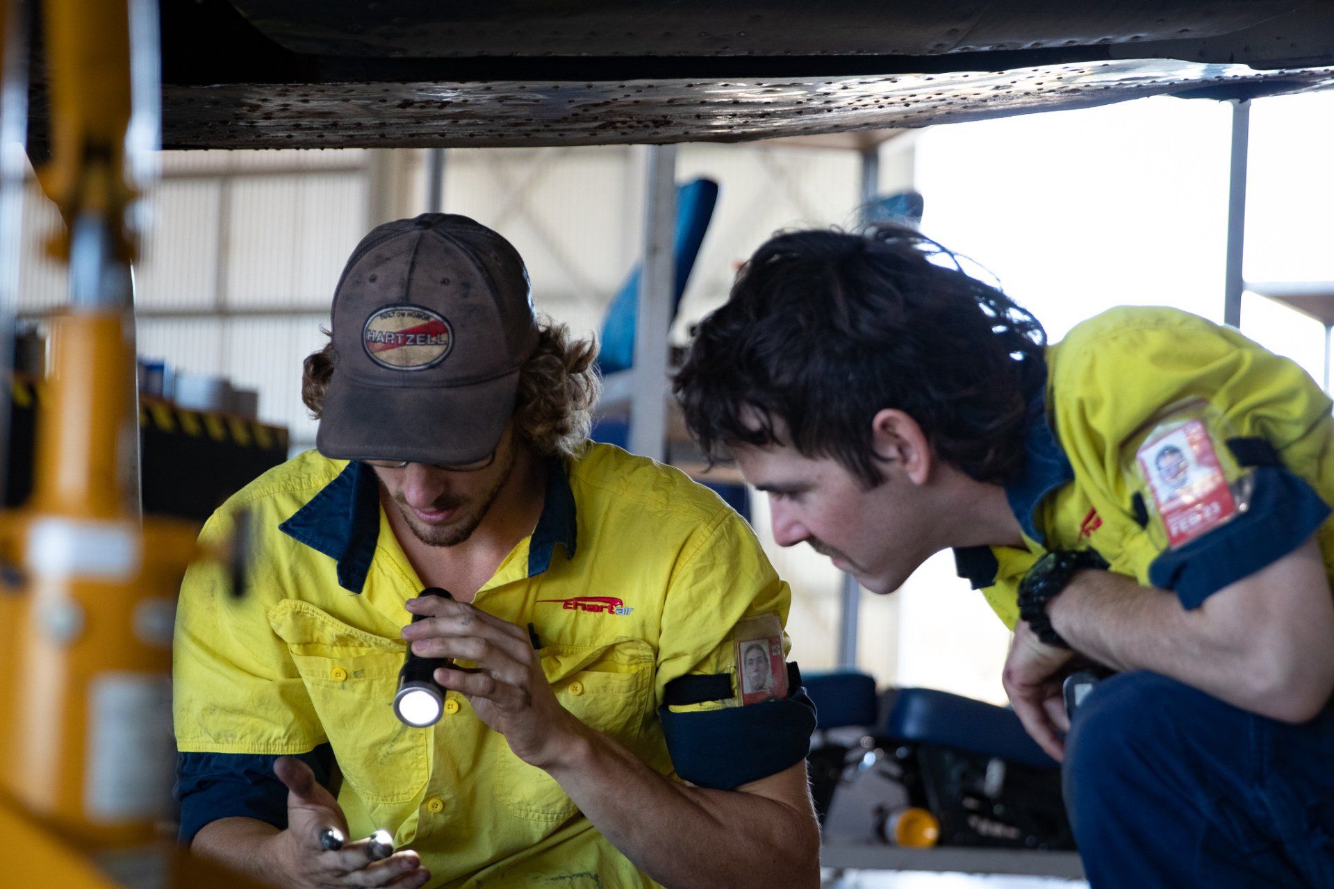 two young engineers working together in the hangar
