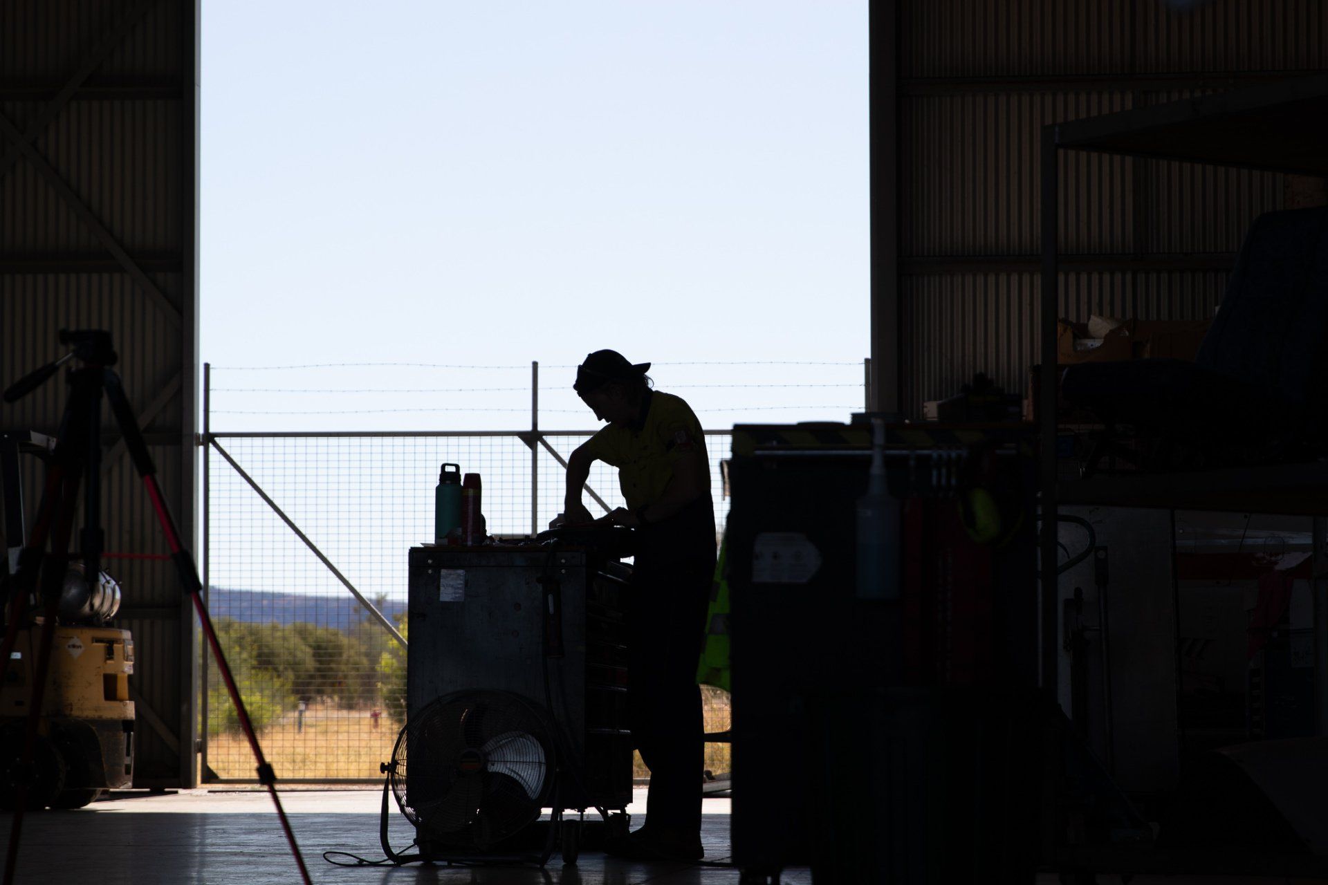 a young man is working with his tools