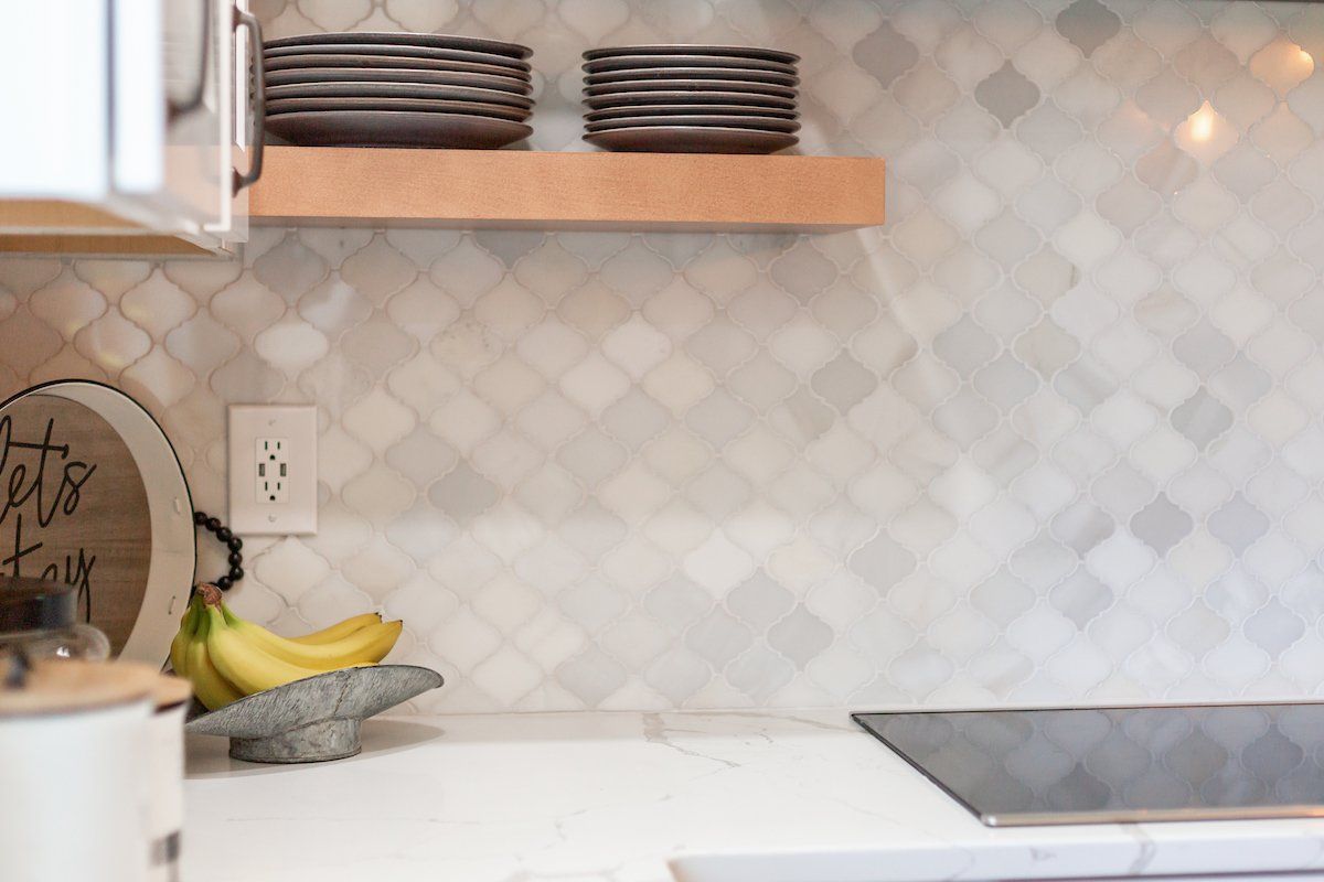 Calacatta Laza Q Quartz Countertops Greecian White Arabesque Tile Waypoint Painted Linen Cabinets