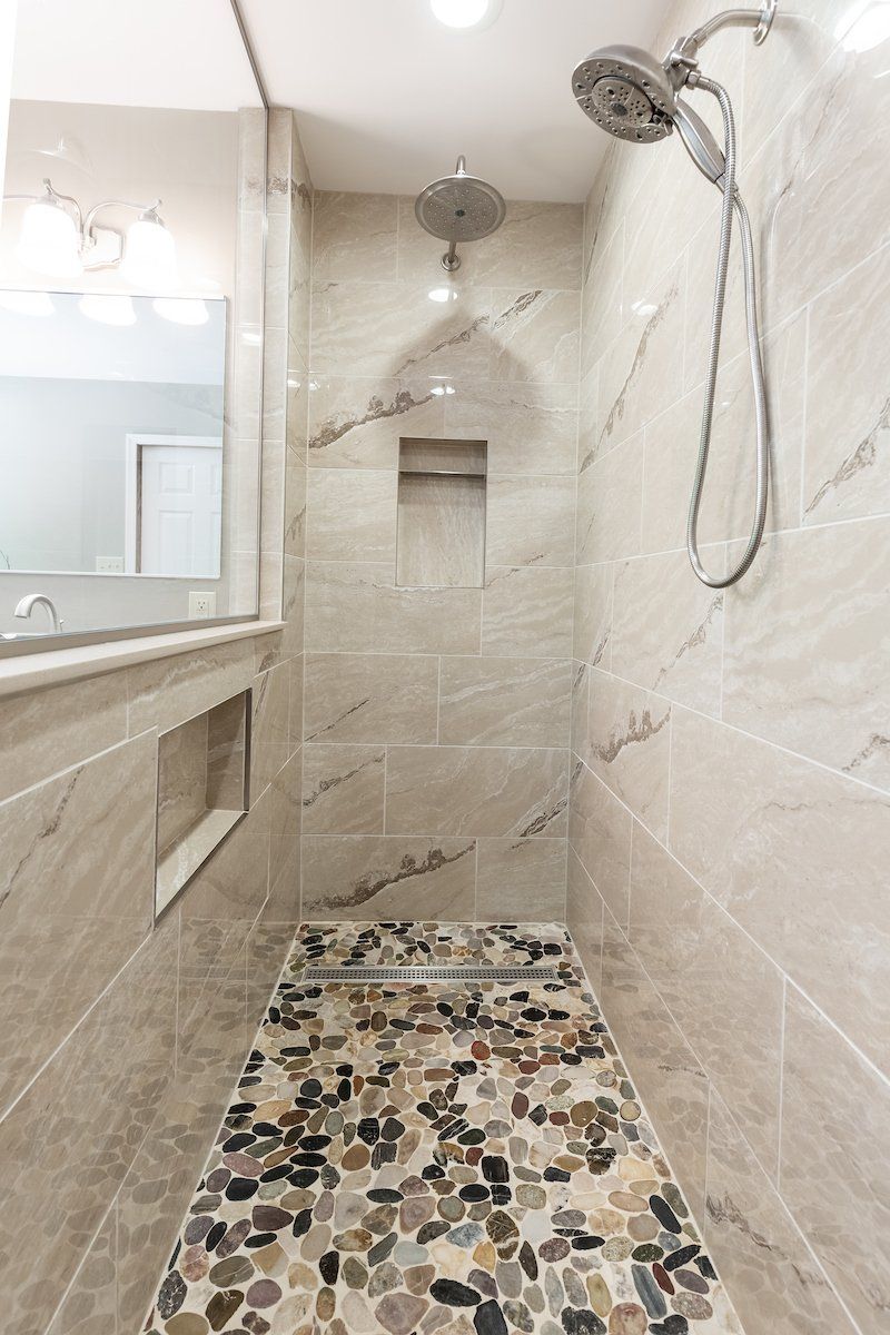 Pietra Vezio Biege 12x24 Tiled Shower Wall, Mixed River Pebble Shower Floor
