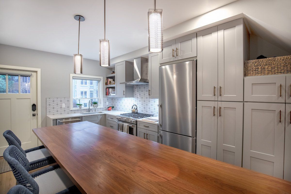 Stone Painted Waypoint Cabinetry and Fresh Concrete Caesartone Perimeter Countertops