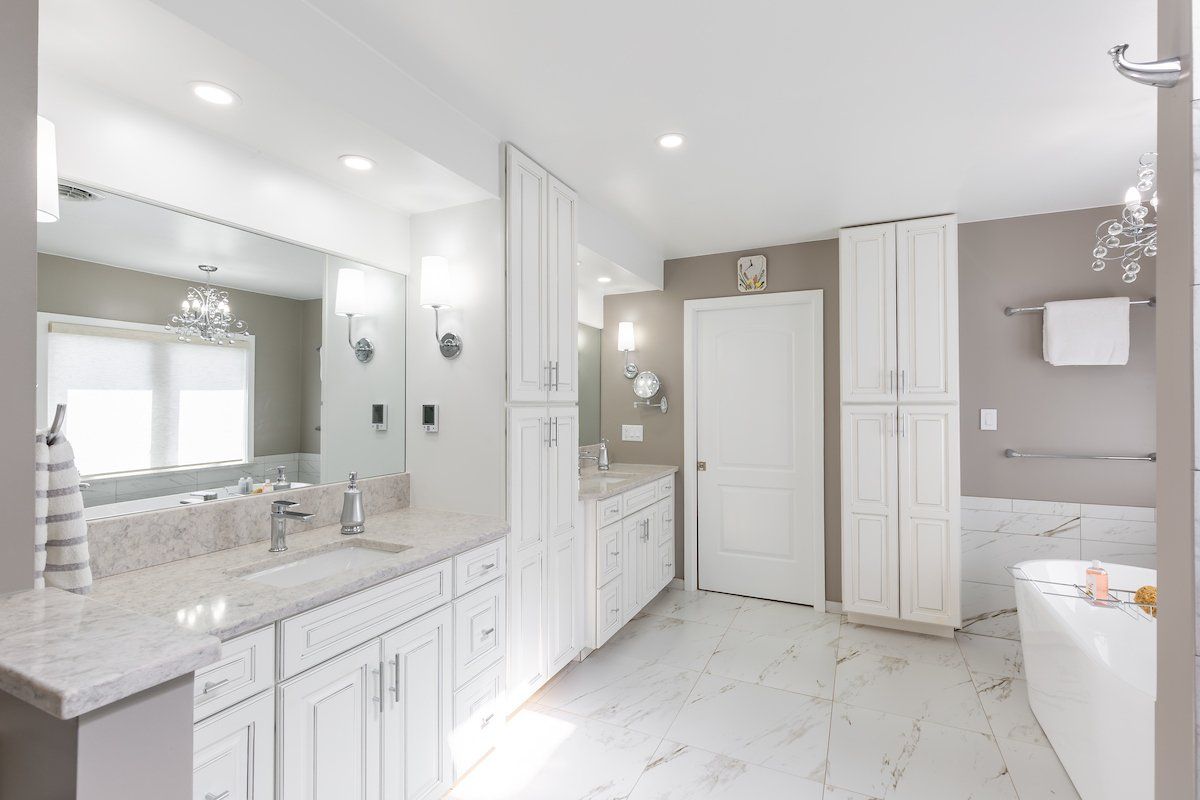 Rolling Fog Q Quartz Countertop Eased Edge and Painted Pewter Glazed Waypoint Cabinets. Lazer Carrara floorTile.
