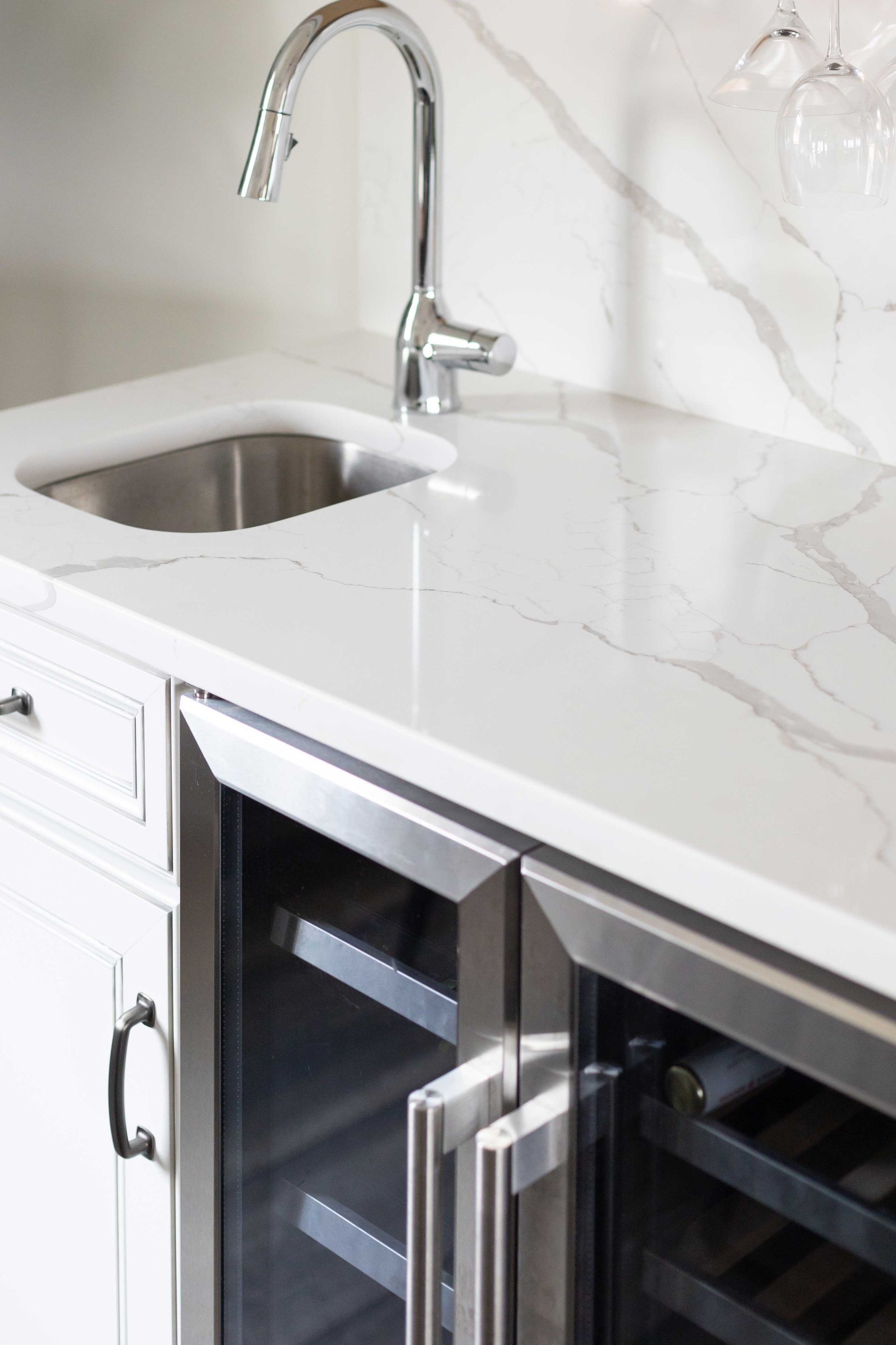 Calacatta Laza Q Quartz Countertop and Highback with Waypoint Painted Pewter Cabinets