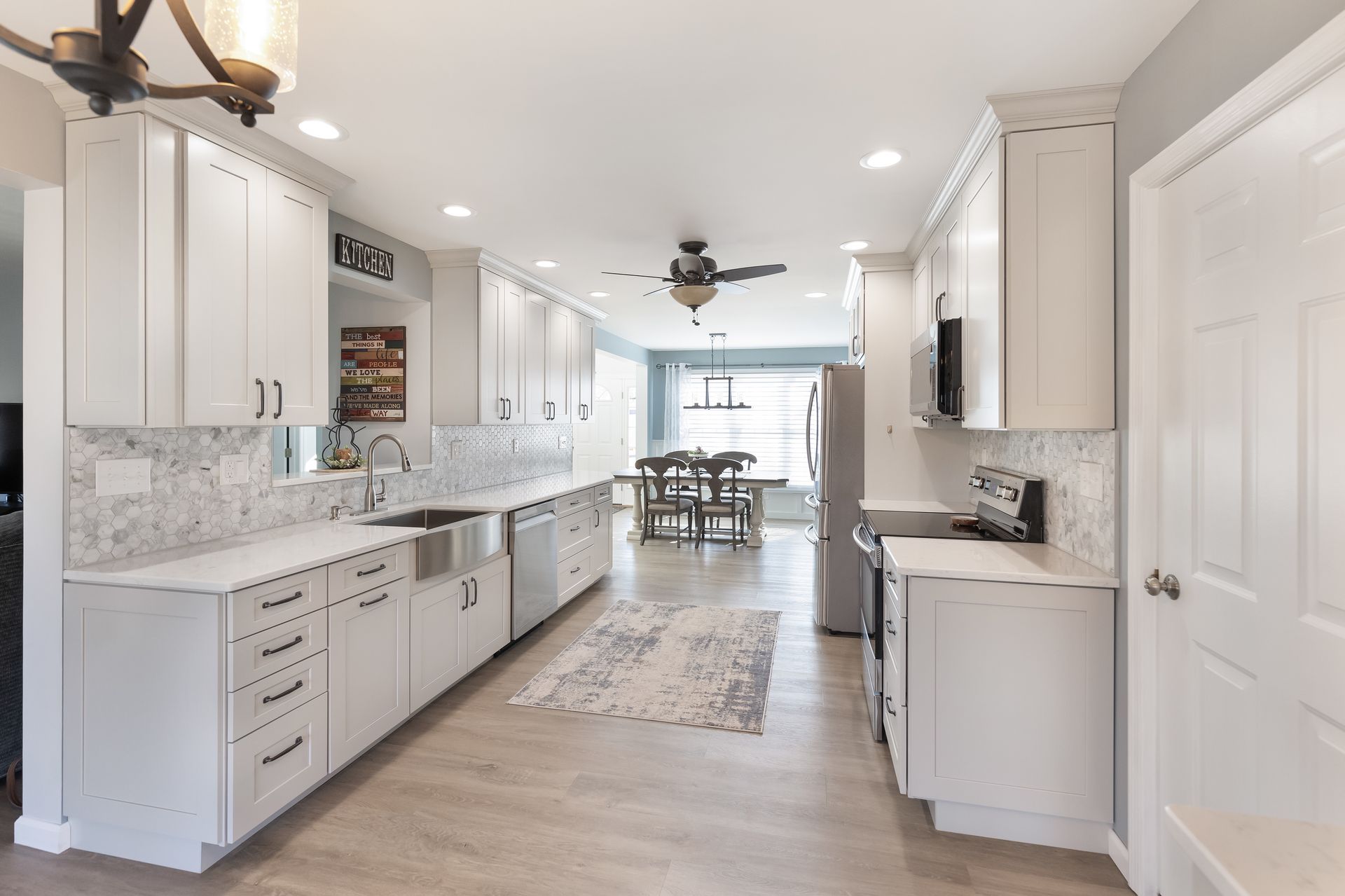 Cashmere Carrara Q Quartz Countertops, and Waypoint Painted Harbor Cabinets