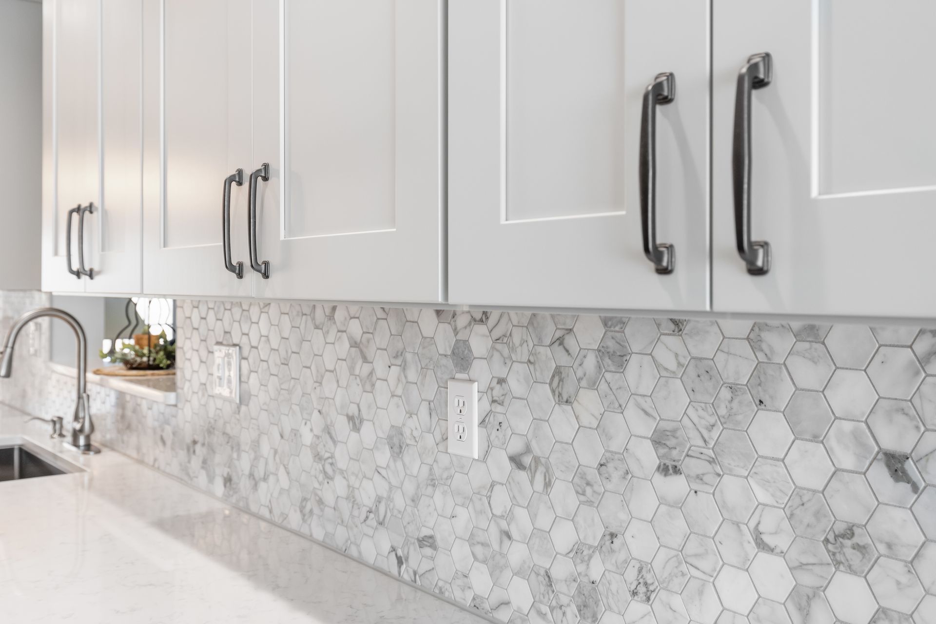 Calacatta Cressa Hexagon Tile Backsplash and Waypoint Painted Harbor Cabinets