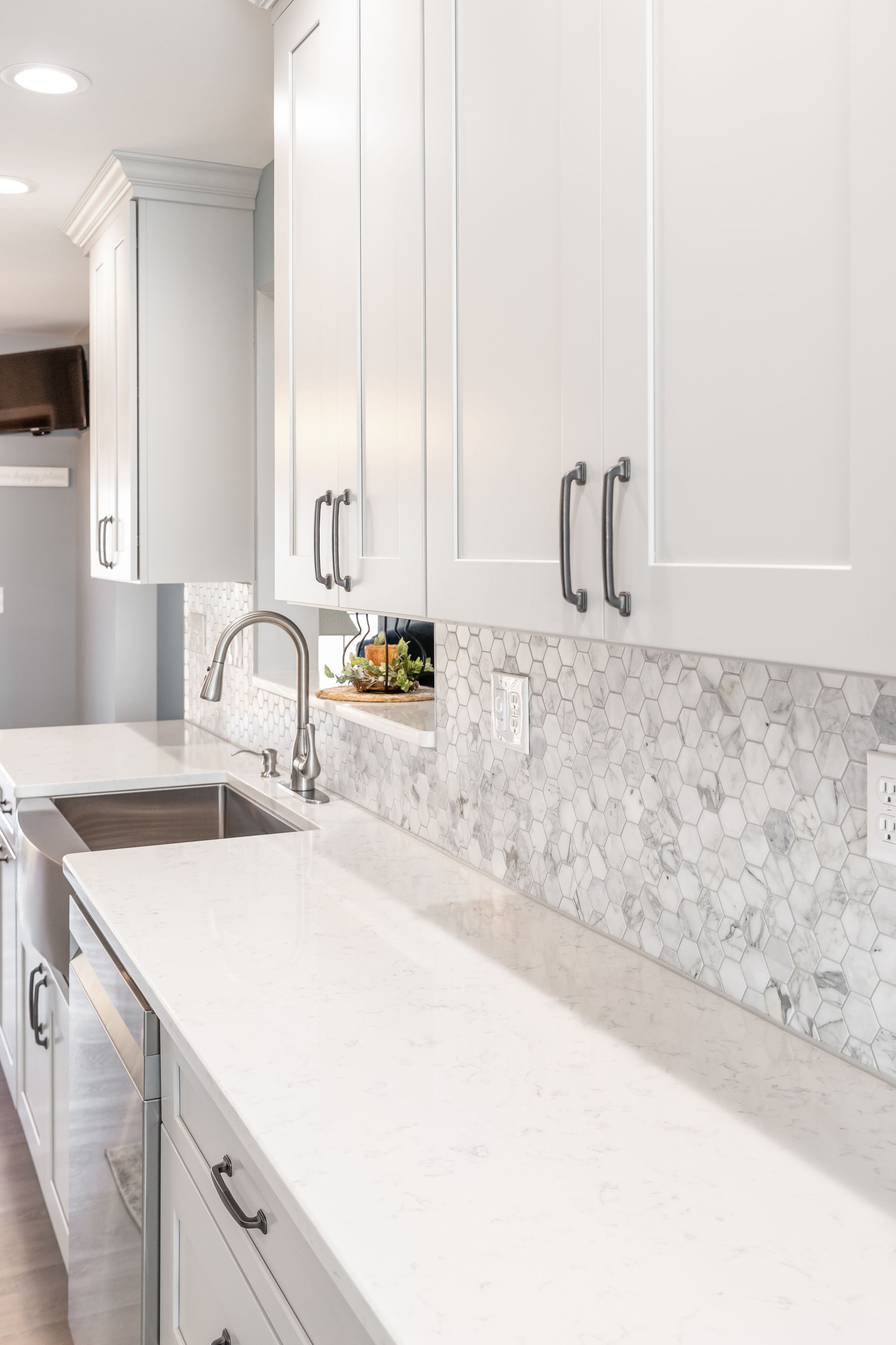 Cashmere Carrara Q Quartz Countertops, and Waypoint Painted Harbor Cabinets