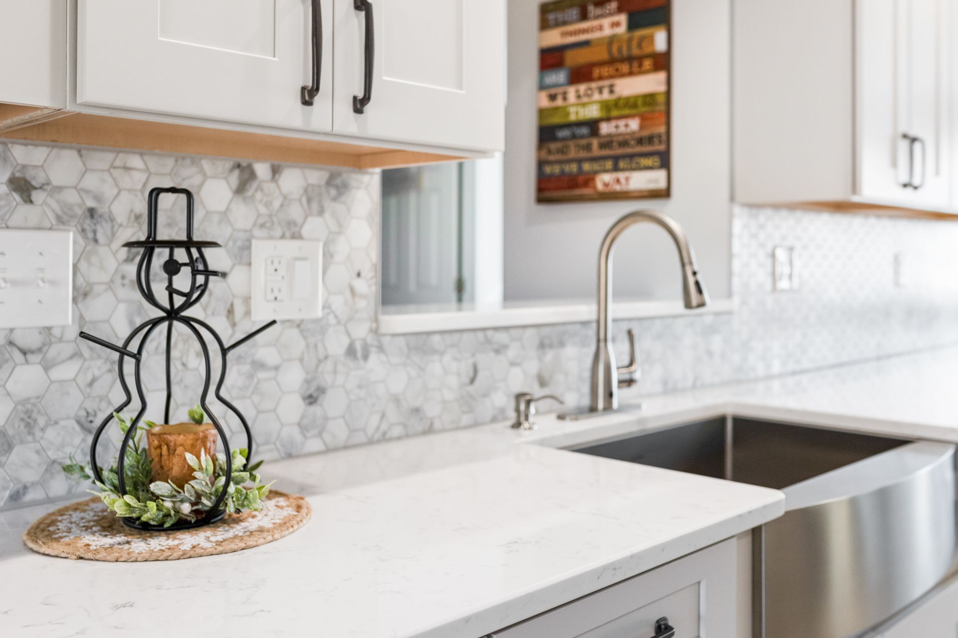 Cashmere Carrara Q Quartz Countertops, and Waypoint Painted Harbor Cabinets