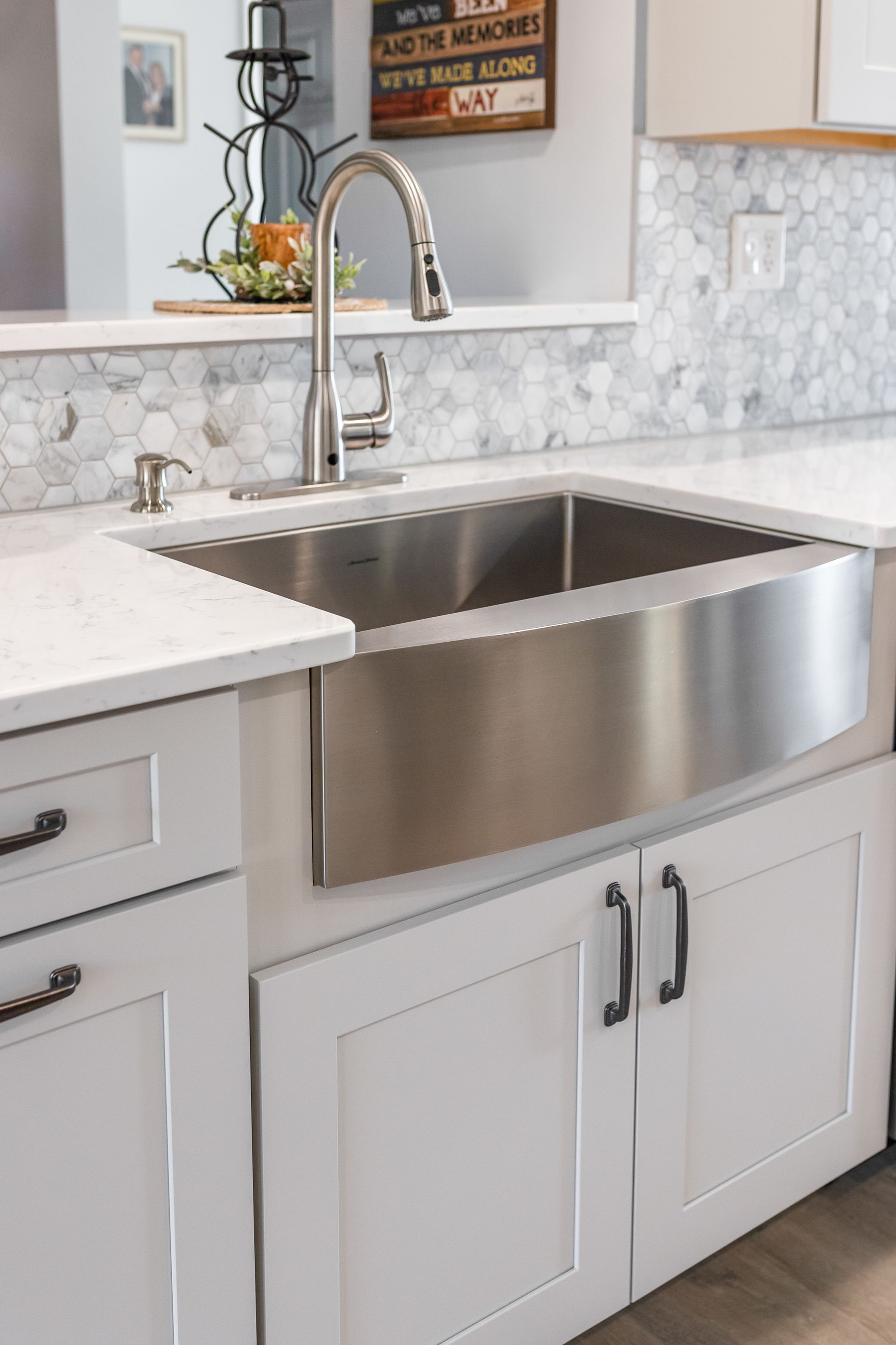 Cashmere Carrara Q Quartz Countertops, and Waypoint Painted Harbor Cabinets