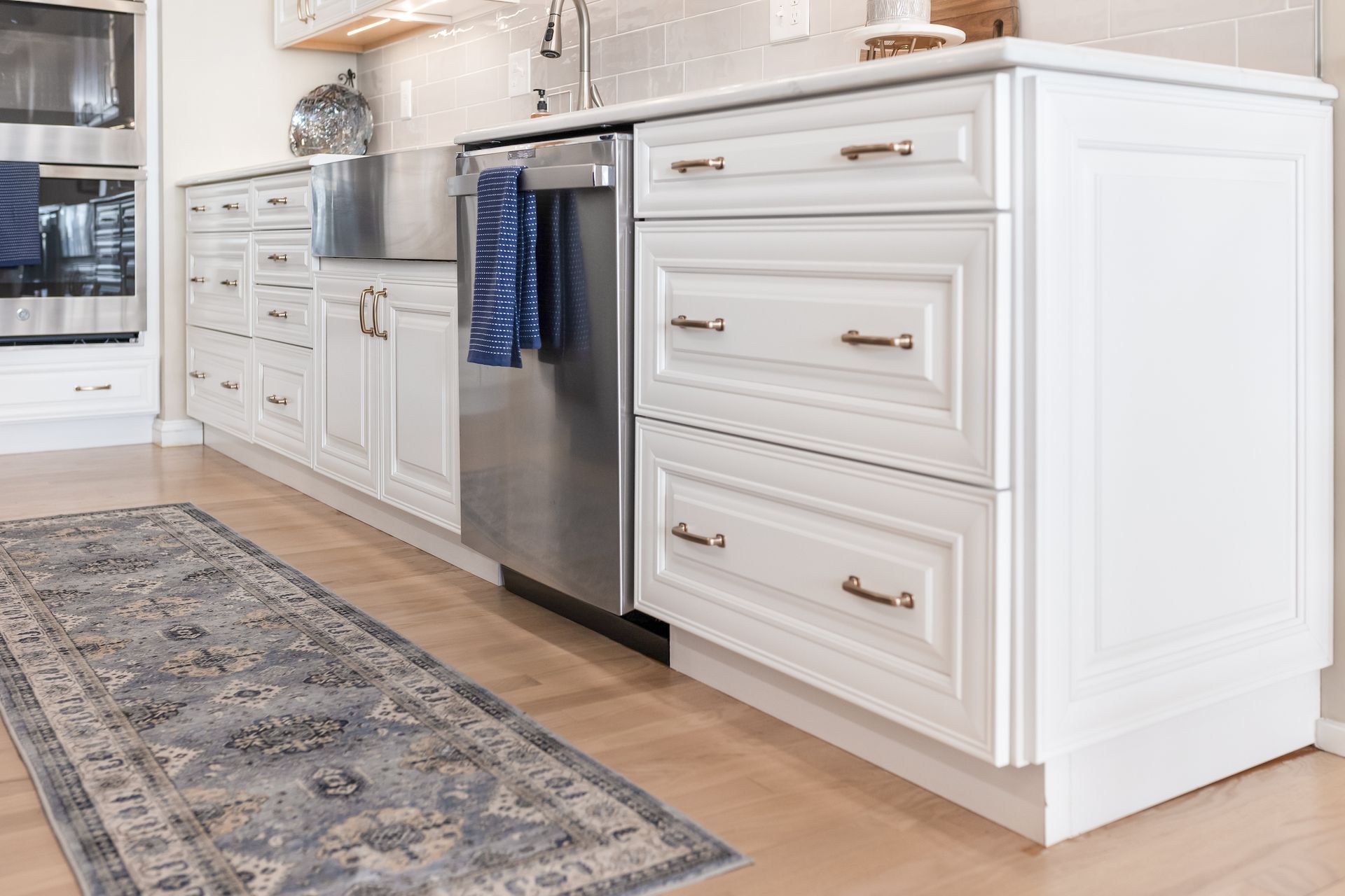 Calacatta Miraggio Cielo Q Quartz Countertops and Waypoint Painted Linen Perimeter Cabinets