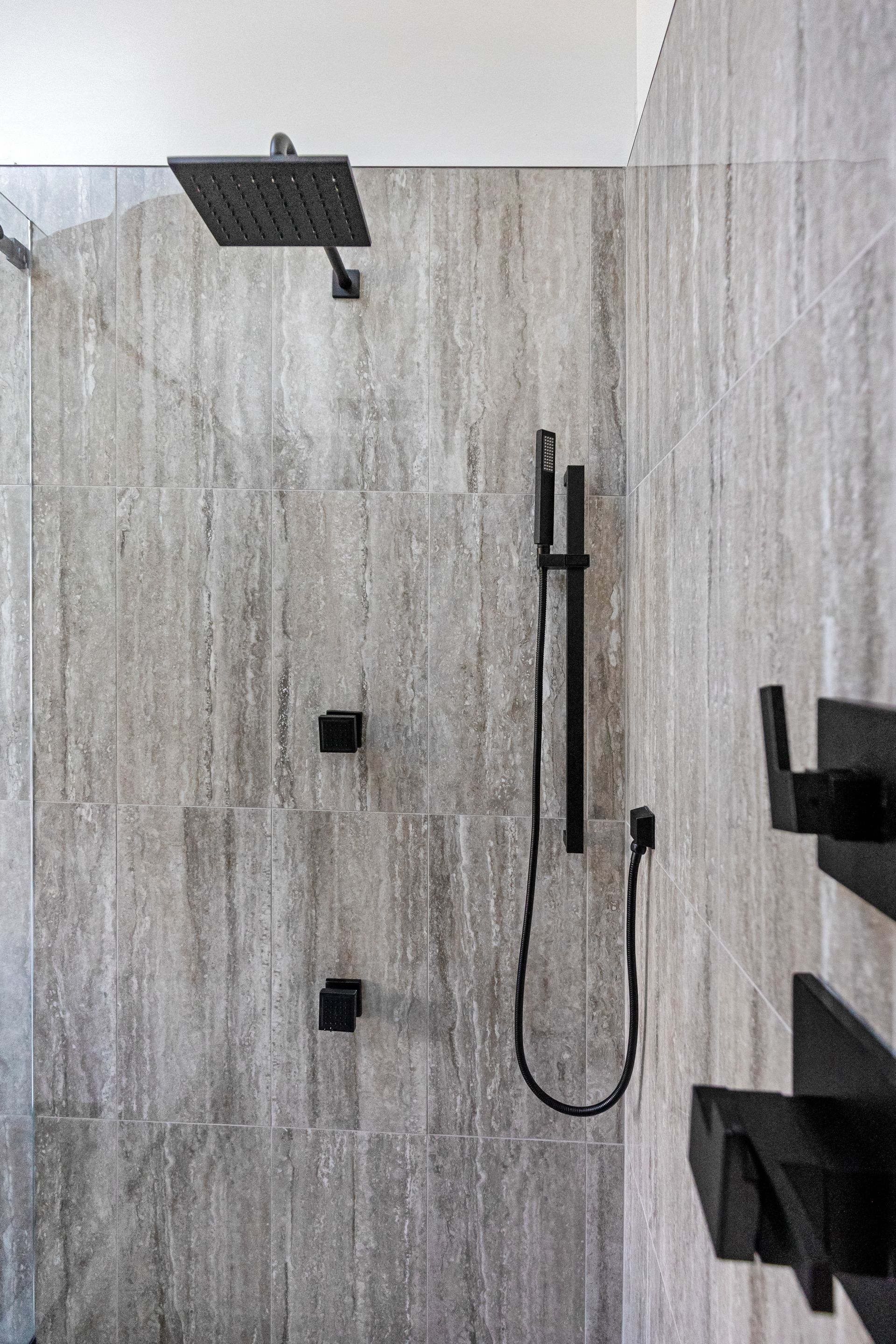 Pietra Veneto Grey Shower Wall Tiles, White Oak Pebbles Shower Floor Tiles, and Nashville Adrock Frost Matte Bathroom Floor Tiles