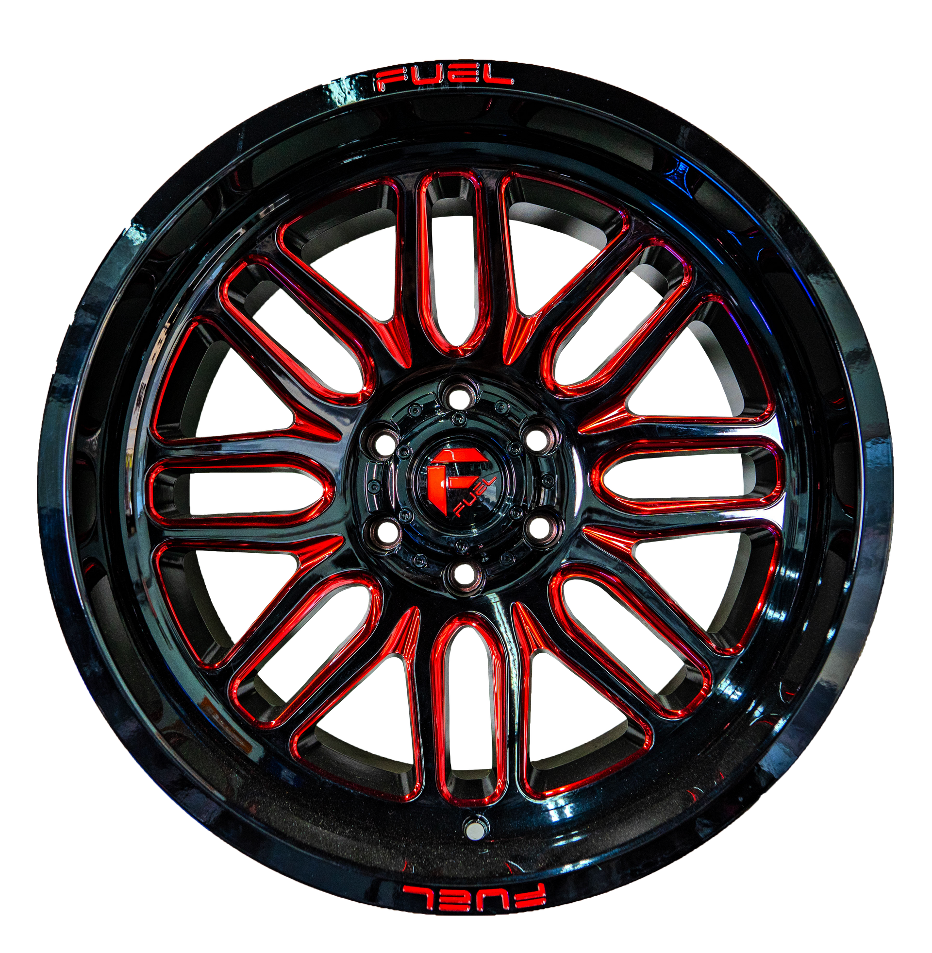 A close up of a red and black wheel on a white background.
