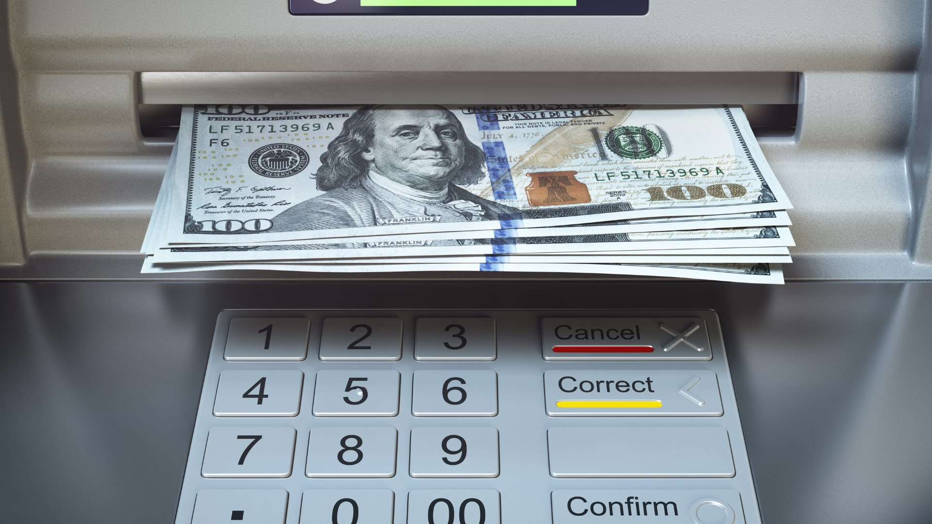 ATM dispensing a stack of hundred-dollar bills. A keypad with number and function buttons is visible.