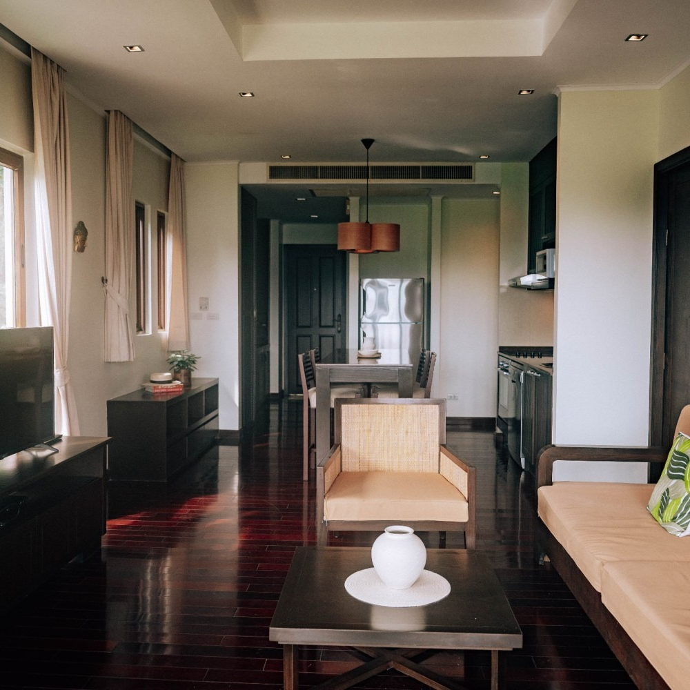 A living room with a couch a chair and a coffee table