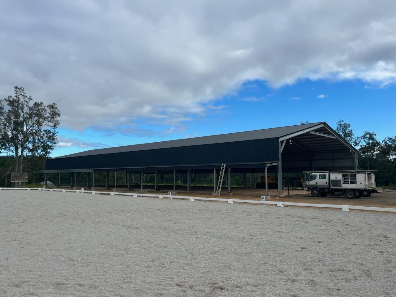 A Blue Shed With a Window and a Sign That Says a Beer — Premier Building QLD In Speewah, QLD