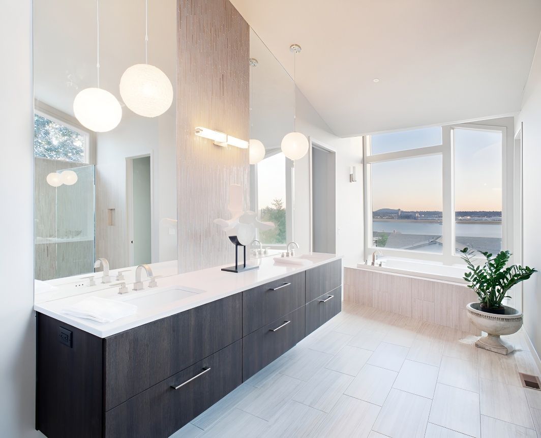 A Bathroom With Two Sinks , a Tub and a Large Mirror — Premier Inspections FNQ In Cassowary Coast, QLD