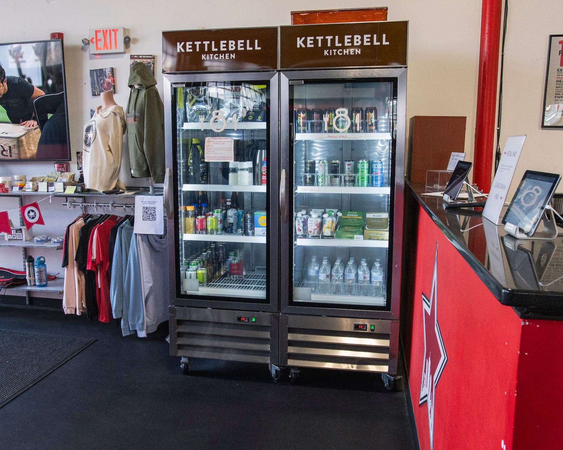 Two kettlebell fridges are sitting next to each other in a store