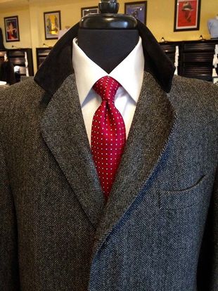 A man in a suit and tie is on a mannequin