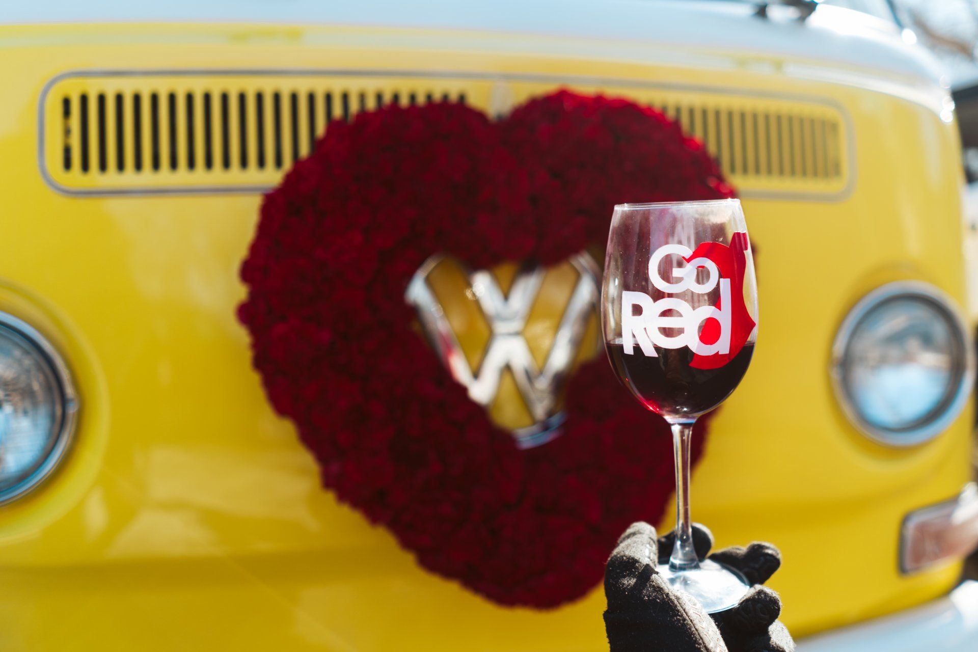 Miss Daisy from SunKissed Photo Bus supports Go Red Chatt and wears a heart wreath made of red roses
