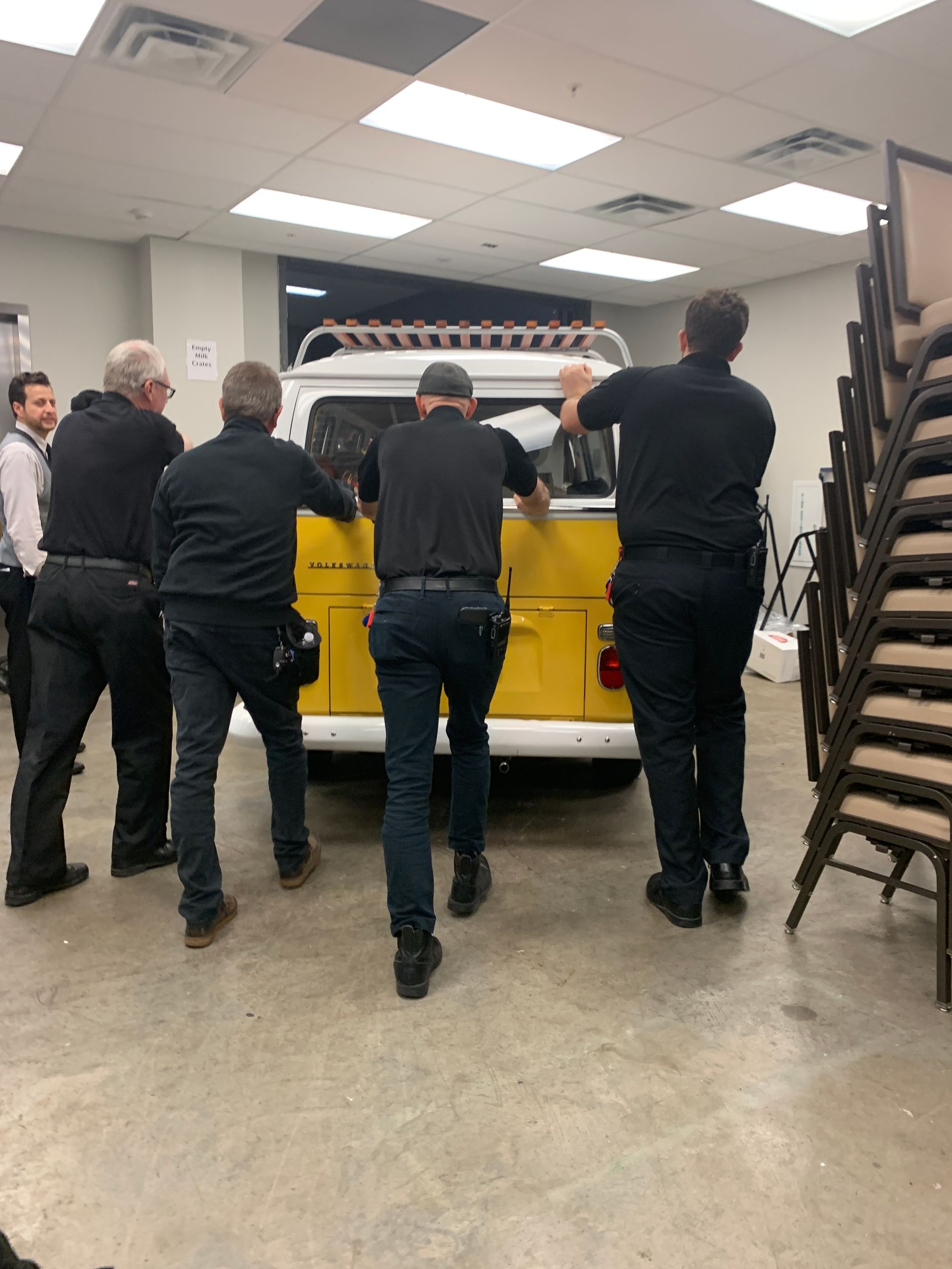 Service men push a VW bus, from SunKissed Photo Bus, from the freight elevator and into the ballroom of the JW Marriott in Nashville, TN