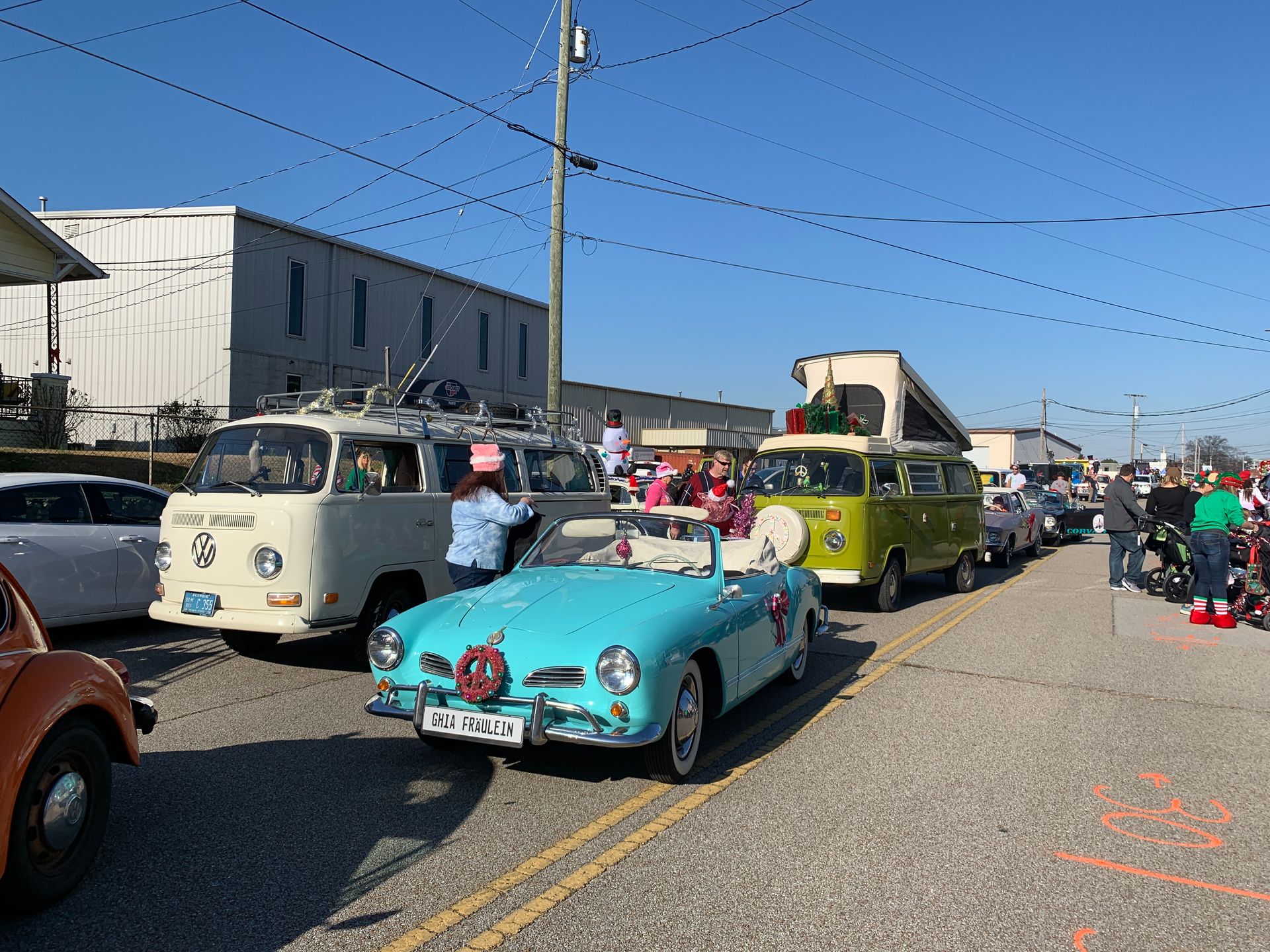 Miss Daisy from SunKissed Photo Bus participating in the MainX24 parade alongside the VW buses in Chattanooga, TN