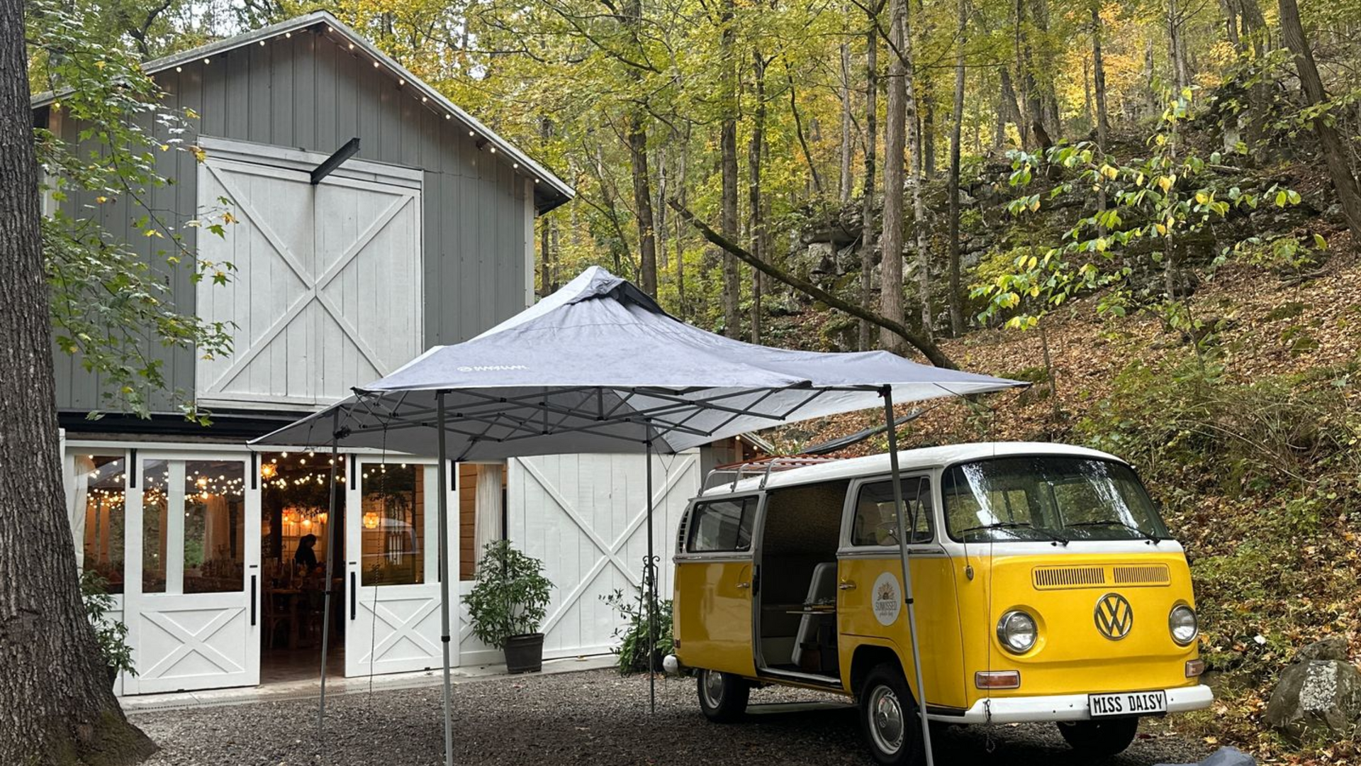 SunKissed Photo Bus set up for a wedding at Oakleaf Cottage with their canopy for a rain plan