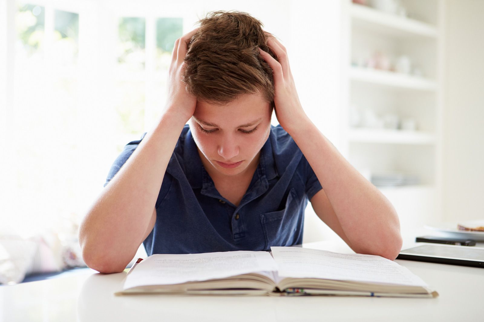 frustrated male teenager because of academic pressure