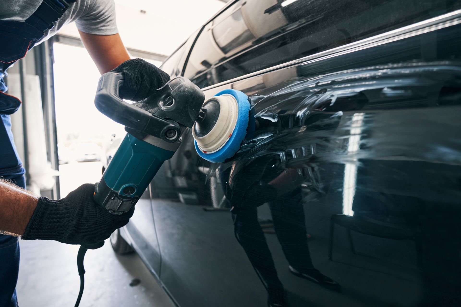A man is polishing a car