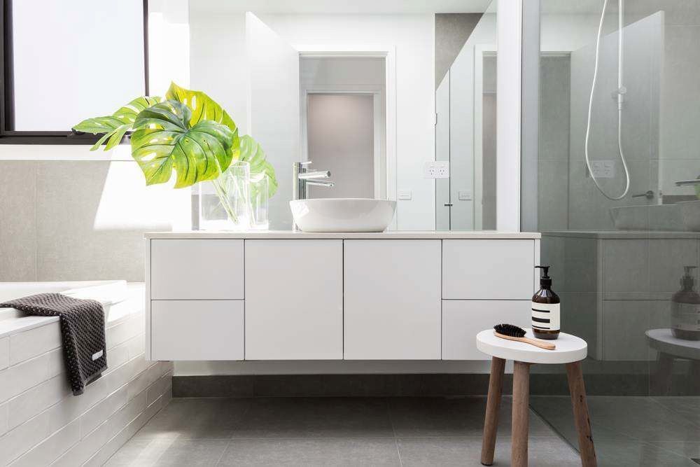 Modern White Bathroom With Floating Vanity, Sink, Glass Shower — Firm Built Bathrooms in Illawarra, NSW