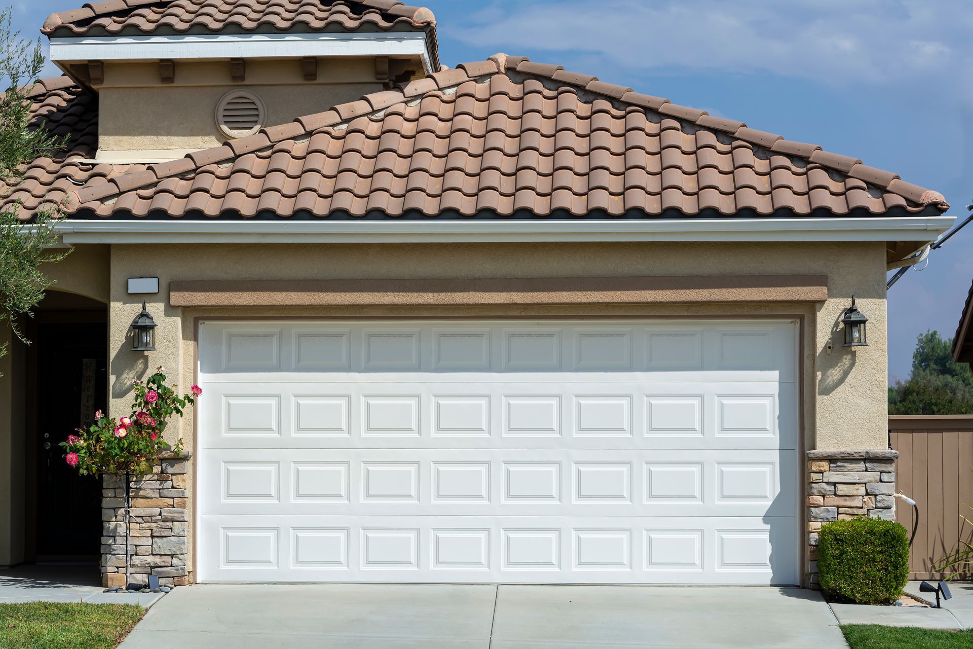 Steel automatic sectional garage door exterior view.
