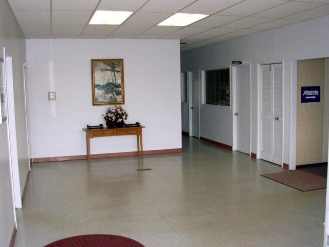 A hallway with a sign that says allstate on it