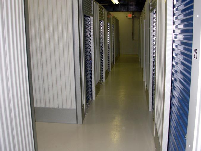 A hallway with a lot of lockers in it